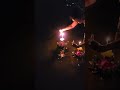 Trying to push our floaties out to sea.  Loy Kratong tradition.   Thailand