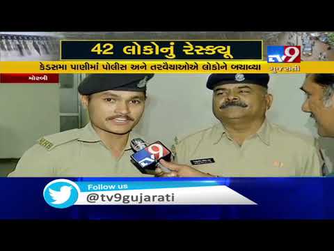 Meet brave cop who carried girls on his shoulder and walked through waist-deep water, Morbi | Tv9