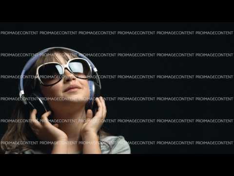 Young Cute Girl with Headphones and Sunglasses