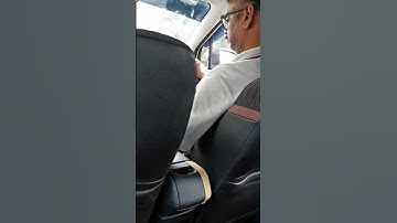 taxi driver reading text in Phone while driving