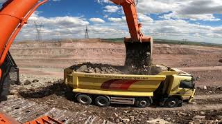 Hıtachı Excavator Truck loads stony material