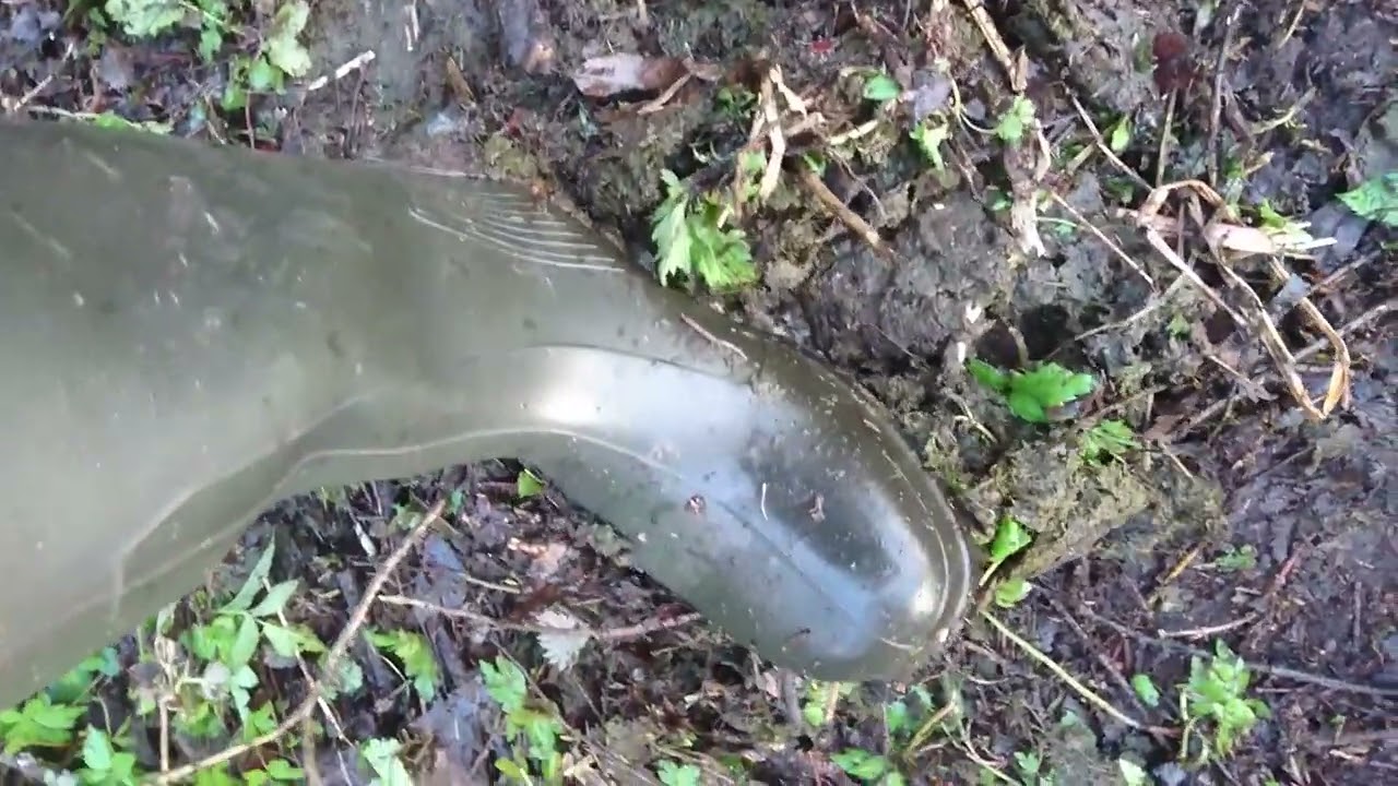 stomping some pile with rubber boots