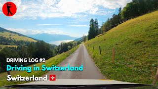 Driving Down a Narrow Road in the Swiss Alps - A Stunning View