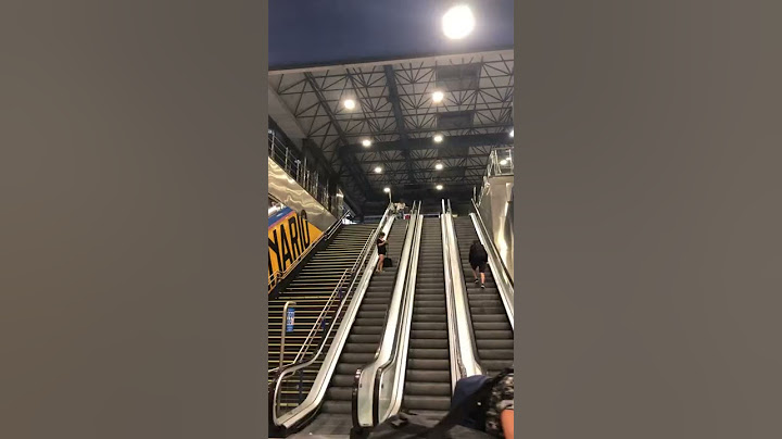 Suitcase Slides Down Escalator || ViralHog