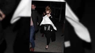 Adele Cuddles Her Baby Son as She Flies In For the Golden Globes - Splash News | Splash News TV Profile