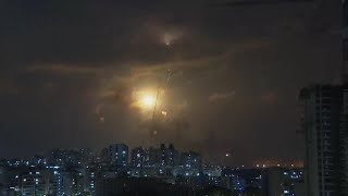 Sirens blare, rockets light up night sky in southern Israel amid war with Hamas