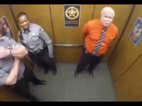 Police officers vibing and dancing in the elevator.