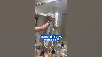 Woman stunned as reflection appears in covered mirror