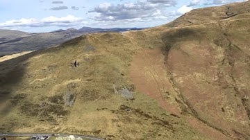 Hawk training jet low-level flying through the Mach loop in mid Wales