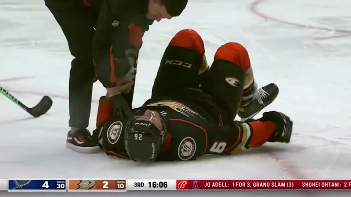 Gerald Mayhew helped off the ice after getting hit...