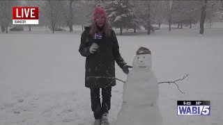 Marleigha & Patrick make a snowman in Monday's storm