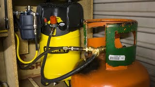 Air compressor reserve tank from a propane bottle