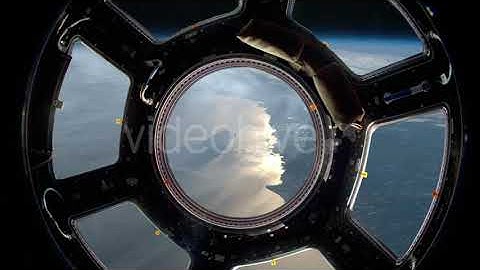 Earth As Seen Through Window Of Space Station | Motion Graphics - Envato elements