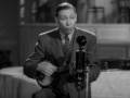 George formby  leaning on a lampost