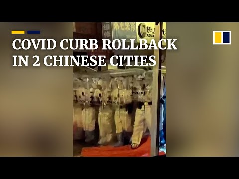 Two massive Chinese cities ease Covid-19 curbs as protests spread