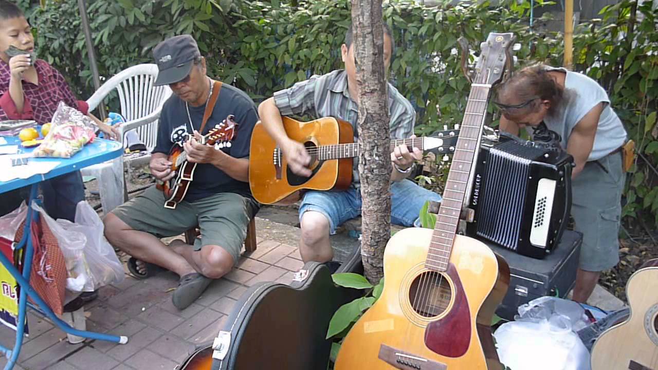 musicians at the second hand market, chiang mai, thailand