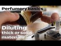 Diluting thick or solid raw materials for perfumery