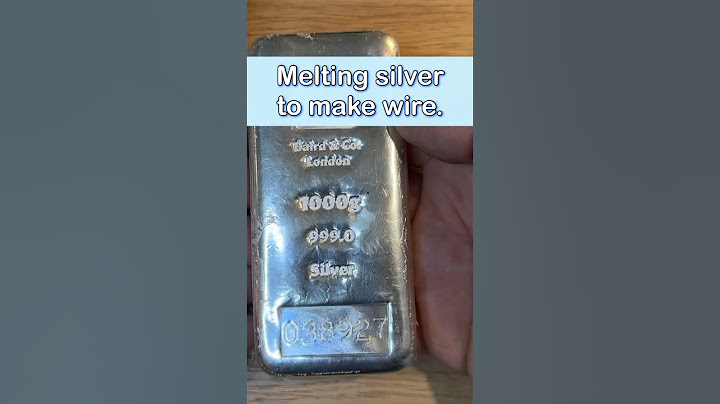 melting a silver bar into grain for making sterling wire.