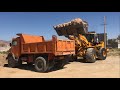 Loading soil in benz 911 truck with hyundai loader 470