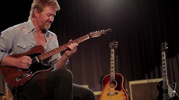 Josh Homme playing George Harrison