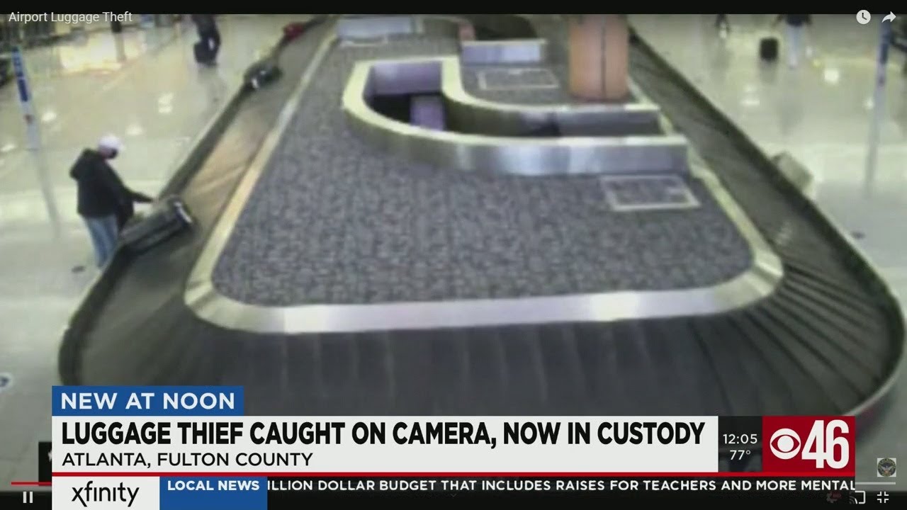 Man caught stealing luggage at Atlanta airport in custody - YouTube