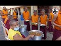 Serving food to monks at namdroling monastery