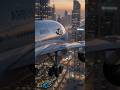 An Airbus A380 flies low through a city skyline at sunset  #cgi #travel #surreal