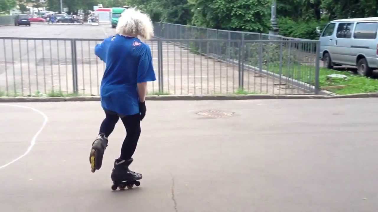 Funny dressed old man skating to the music outside ВВЦ