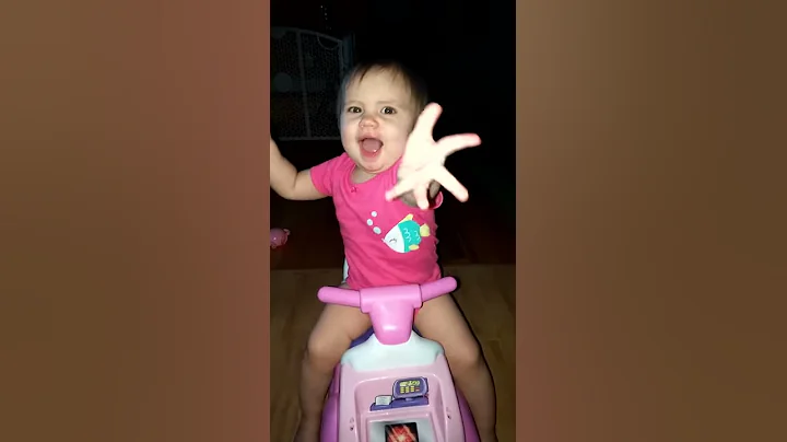 Playing on her car