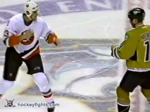 Eric Cairns vs Jim McKenzie from the New York Islanders at Nashville Predators game on Nov 15, 2003. via http://www.hockeyfights.com.