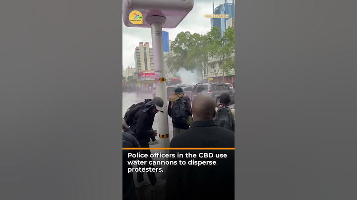 Police officers in the CBD use water cannons to disperse protesters.