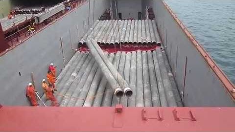 Loading pipes by crew of the V Castle  Carisbrook