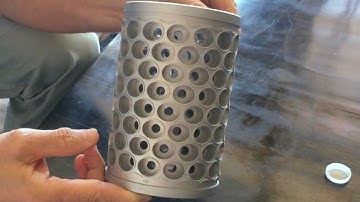 David Freeman shows a Softgel Encapsulation Die used to make Paintballs