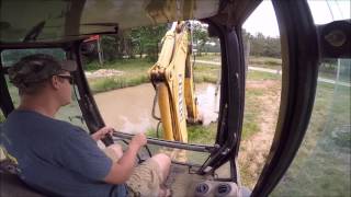 Backhoe Digging Mud