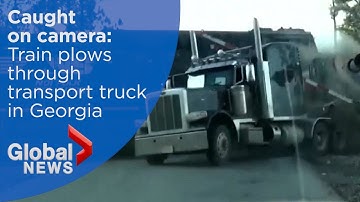 Georgia train plows into transport truck stranded at rail crossing