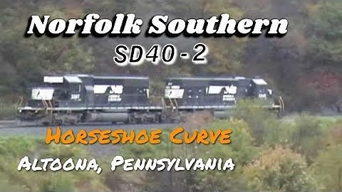 NS eastbound SD40-2 helper units on Horseshoe Curve. Altoona, PA. Date 10-18-03. Time 1:30 pm.