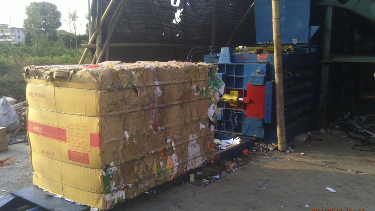 Baling Newspaper With A Downstroke Baler