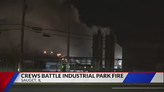 Emergency crews continue to battle industrial park fire