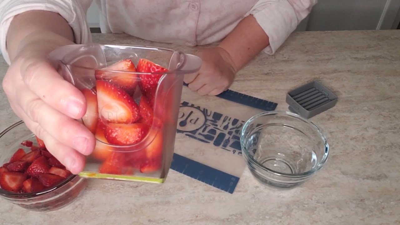 The Pampered Chef Cup Slicer cutting fresh strawberries 