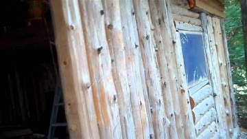 Stockade style log garage