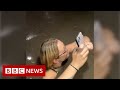 Friends trapped in flooding elevator during US storm - BBC News