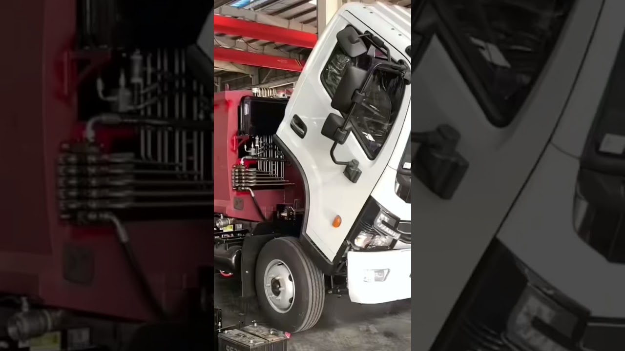 compression garbage truck factory workshop display.