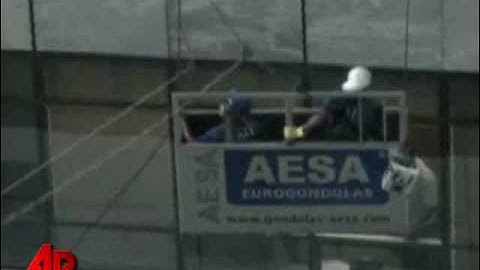 Raw Video: Window Washers Dangle During Storm