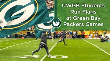 UW-Green Bay: Students Run Flags at Green Bay Packers Game at Lambeau Field
