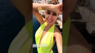 Victoria Bonya enjoys the nice weather in a neon yellow bathing suit at the Eden Roc in Antibes