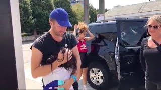 Chris Martin hugging a fan
