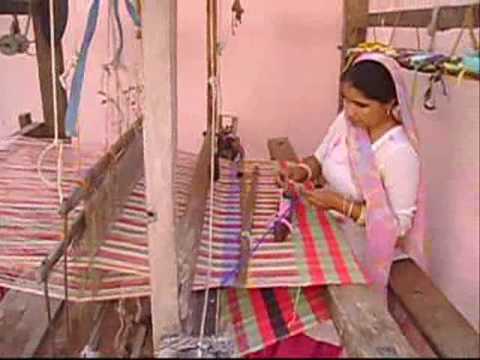Products of daily, day-to-day usage made out of recycled handloom fabrics. The recycled handloom fabric is woven manually on traditional looms using old wool or old and torn clothes. This form of recycling waste cloth and woolens is practiced in India in the villages of Yamunanagar, Haryana. Voluntary Organisation - Jagriti is undertaking to market the recycled handloom products made by the poor rural women and handloom workers.