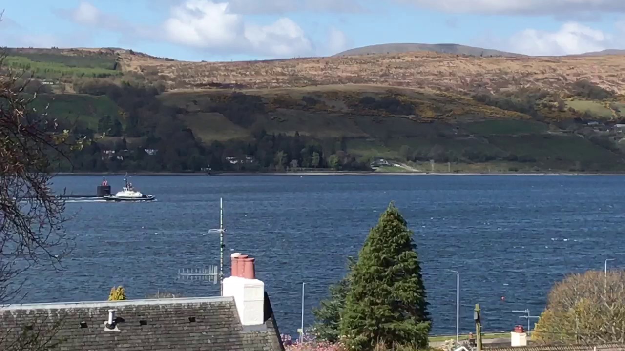 Submarine being escorted to Faslane