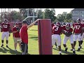 Defensive line works on shedding blocks and attacking the ball carrier