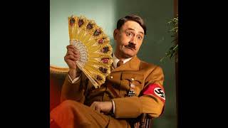 FIRF #11 - Jojo Rabbit
The eleventh installment of Fresh Immigrants, Rotten Fascists forces us to confront what happens when hateful ideologies spread to children, and features Taika Waititi prancing around as an imaginary Hitler. It’s JOJO RABBIT!
Thank you for checking this new project out, whether you are a long-time Contrarians fan or someone who’s just trying to listen to people talking positively about immigrants and negatively about fascism. If you have any recommendations for future entries in the series, let us know!
Many thanks to the amazing Jordan Cooper (https://www.jordancoopermusic.com) for composing our intro and outro. Fantastic collaborator to work with - and he has a They Might Be Giants podcast: DON’T LET’S START (https://creators.spotify.com/pod/profile/dontletsstart/) . You can also check out Jordan’s band TROUBLE’S AFOOT (https://troublesafoot.bandcamp.com) on Bandcamp!
- Interested in more Contrarians goodness? Join THE CONTRARIANS SUPPLEMENTS on our Patreon Page! (https://www.patreon.com/contrarianprime) Deleted clips, extended plugs, bonus episodes free from the Tomatometer shackles… It’s everything a Contrarians devotee would want!
- Our YouTube page (https://youtube.com/@contrarianprime) is live! Get some visual Contrarians delight with our Contrarians Warm-Ups (https://youtube.com/playlist?list=PLDVkVTb56Rey9AmjdpFToARV8Jmg-p8mK) and other fun videos!
- Our buddy Cory Ahre is being kind enough to lend a hand with the editing of some of our videos. If you like his style, wait until you see what he does over on his YouTube Channel. (https://www.youtube.com/channel/UCaGFy78w465mBDsEp0eY_pQ)
- THE LATE NIGHT GRIN isn’t just a show about wrestling: it’s a brand, a lifestyle. And they’re very supportive of our Contrarian endeavors, so we’d like to return the favor. Check out their YouTube Channel! (https://www.youtube.com/c/latenightgrin) You might even spot Alex there from time to time.
- Hans Rothgiesser, the man behind our logo, can be reached at @mildemoniospe on Instagram (https://www.instagram.com/mildemoniospe/?hl=en) or you can email him at mildemonios@hotmail.com in case you ever need a logo (or comics) produced. And you can listen to him talk about economy on his new TV show, VALOR AGREGADO (https://canalb.pe/watch/valor-agregado/) . Aaaaand you can also check out all the stuff he’s written on his own website (http://www.mildemonios.pe/) . He has a new book: a sort of Economics For Dummies called MARGINAL (https://www.arcadiamediatica.com/libro/marginal_44382) . Ask him about it! FIRF #11 - Jojo Rabbit